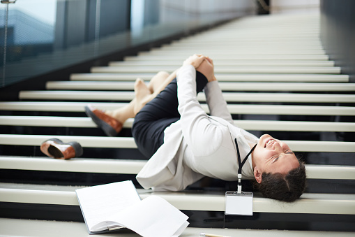 Business lady falling down stairs